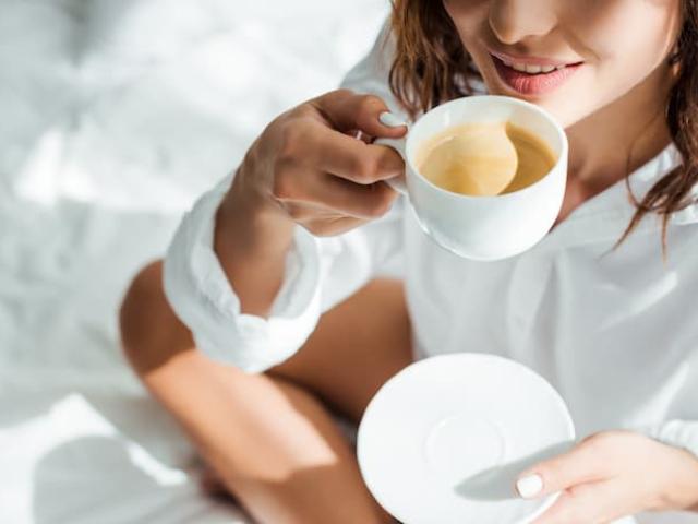 woman enjoying the benefits of coffee